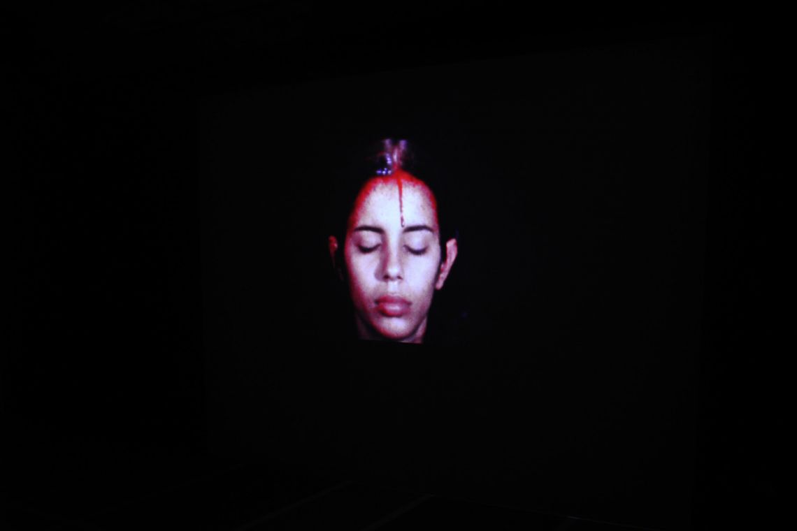 Ana Mendieta. Exhibition view of the super-8mm film transferred to high-definition digital media Sweating Blood (1973) at the III Venice International Performance Art Week 2016. Photograph by We Exhibit.