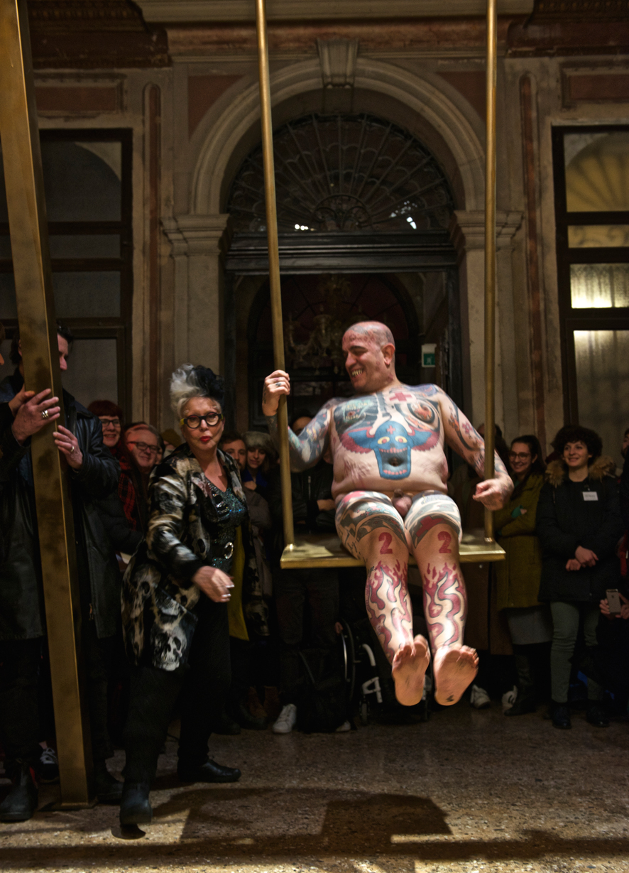 Franko B, I'm Thinking of You. Performance at the III Venice International Performance Art Week 2016. Franko B pushed on his golden swing by ORLAN. Image © Edward Smith